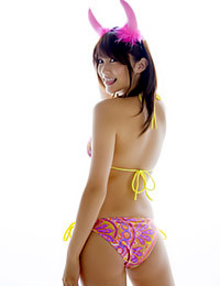 Gorgeous Asian teen babe with a stunning smile Mikie Hara playfully poses in her pink devil horns.